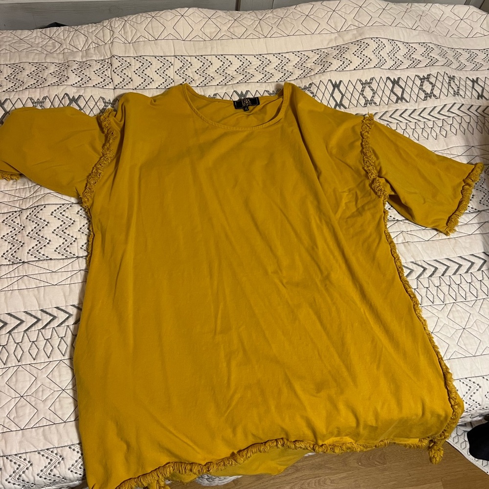 Ladies, short sleeve knit top with fringe accent